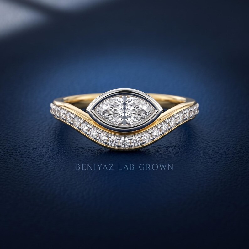 Marquise lab grown diamond engagement ring with curved diamond wedding band in yellow and white gold, front view showing ring height and detailed bridal set design.