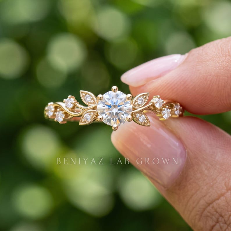 Close-up of diamond leaf ring with round lab grown diamond center, botanical details and whimsical nature inspired engagement design.