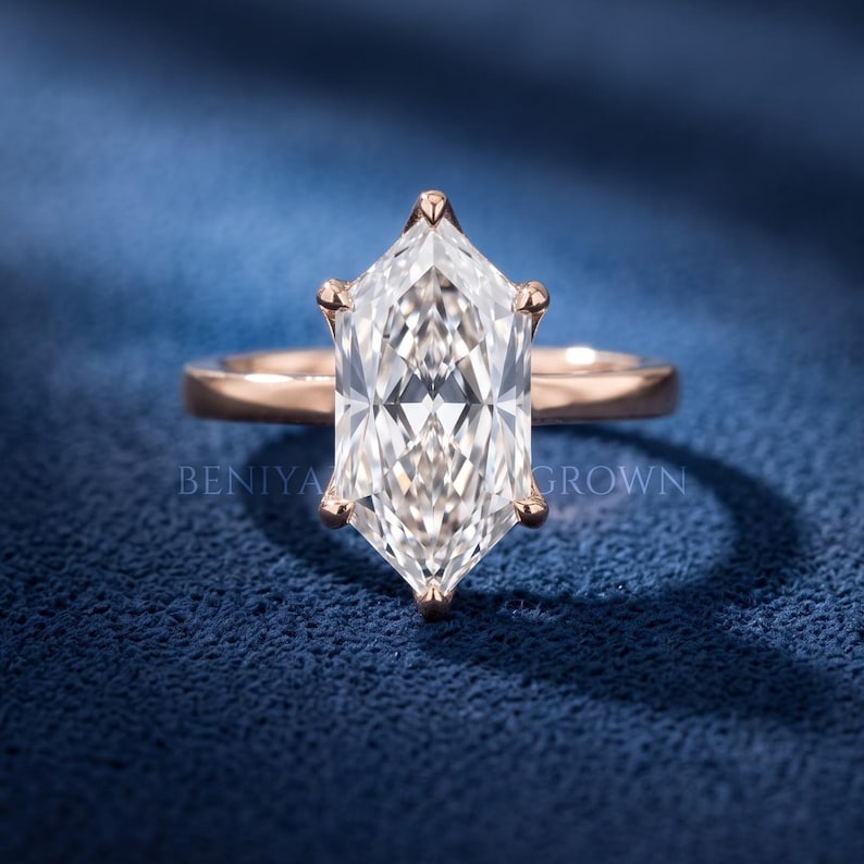 3.59 carat Dutch marquise lab grown diamond solitaire engagement ring with six prong setting and plain polished band.