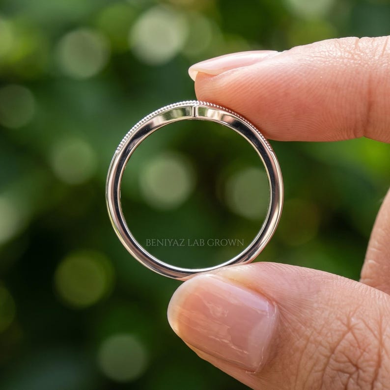Full rear view of curved wedding band showing the smooth round shank and V shaped nesting profile.
