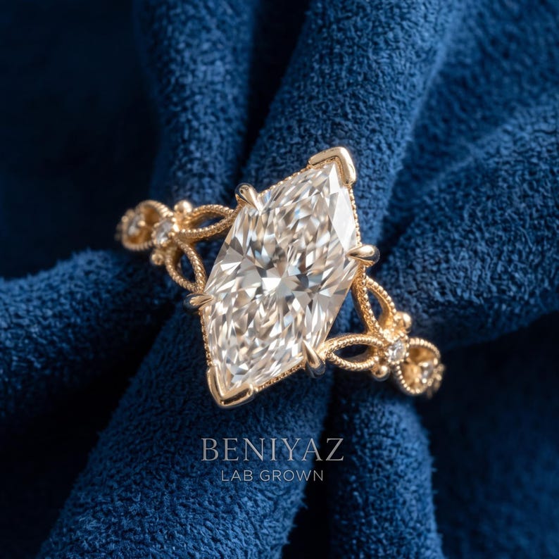 May include: A gold ring featuring a large marquise-cut center stone and smaller accent stones along the band. The band has an intricate, openwork metal design. The text BENIYAZ LAB GROWN is printed in white at the bottom of the image.