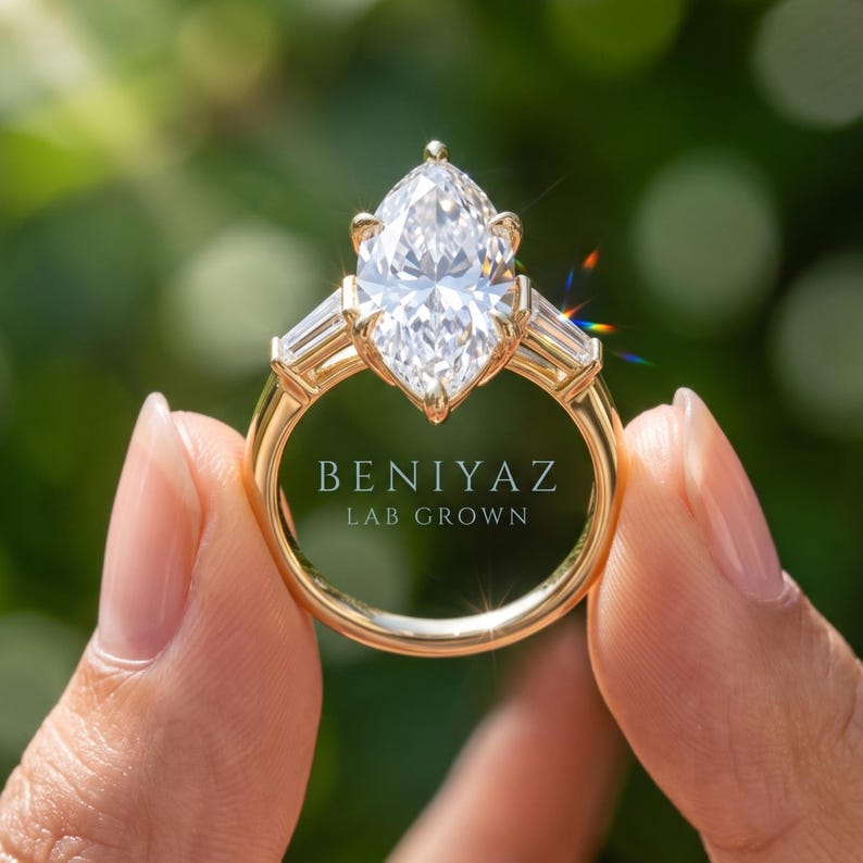 Rear view of elongated Dutch marquise engagement ring held by hand showing open gallery, prong setting and polished shank