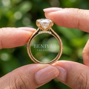 Back profile of a marquise lab grown diamond ring showing the cathedral style shoulders and polished gold shank.