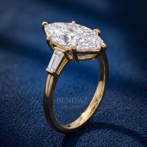 Side angle studio view of Dutch marquise lab grown diamond ring showing raised prong setting, gallery and polished shank