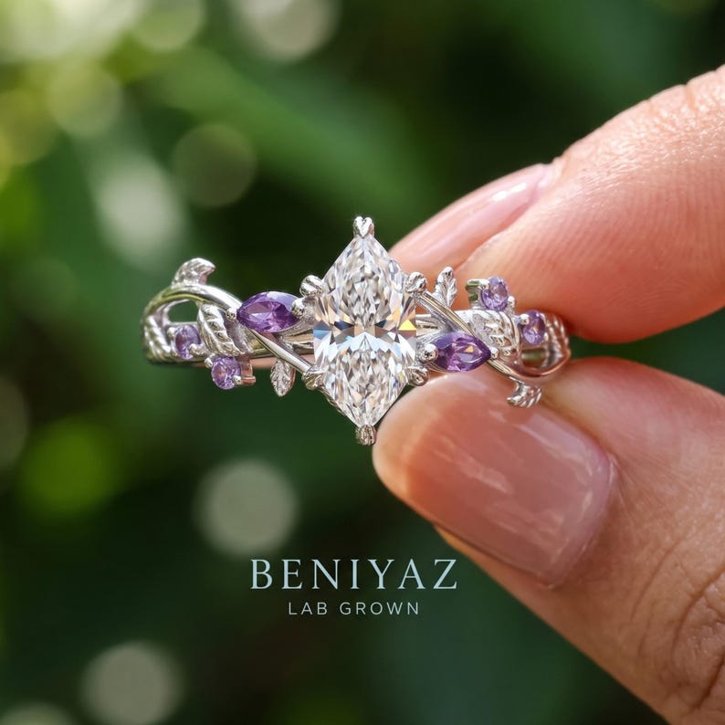 Close up of botanical engagement ring with Dutch marquise lab grown diamond, Tanzanite accents and detailed vine shoulders.
