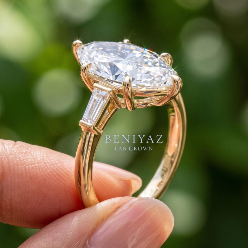 Side profile of Dutch marquise lab grown diamond engagement ring showing raised prong setting, side stones and slim polished band
