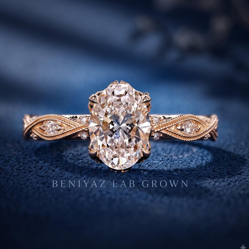 Vintage oval lab grown diamond engagement ring in rose gold with a milgrain marquise accent band and oval centre stone.