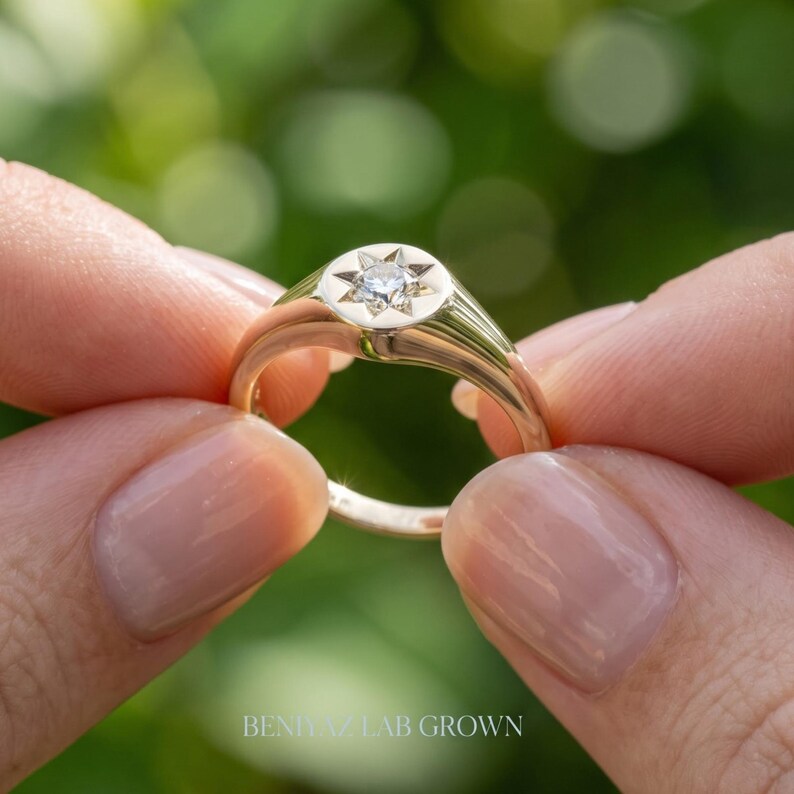 Back view of champagne lab grown diamond signet ring showing round signet face, smooth tapered shank and polished finish