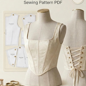 May include: A cream-colored corset top with a square neckline and a subtle floral pattern, displayed on a mannequin. The back features a lace-up closure with gold grommets. Includes a sewing pattern sheet with labels and gold-toned scissors.