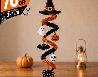 May include: A hanging crochet spiral decoration featuring a black witch hat at the top, followed by a white ghost, an orange jack-o'-lantern, a black bat, a white skull, and a black spider dangling from the orange and black yarn structure.
