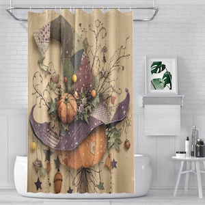 May include: A shower curtain featuring a beige background with a large, patchwork-style witch hat and a pumpkin. The design includes autumn leaves, small berries, and hanging star-shaped ornaments in shades of orange, purple, and green.