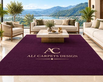 May include: A large, rectangular, deep purple area rug featuring the gold-colored logo and text "AC ALI CARPETS DESIGN" centered on its surface. The rug has a solid, uniform color and a smooth, low-pile texture, covering the floor space.
