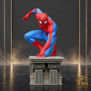 May include: A Spider-Man figurine in a crouching pose, featuring the iconic red and blue suit with a black web pattern and large white eyes. The character is mounted on a gray, rectangular stone-style pedestal with carved floral details.