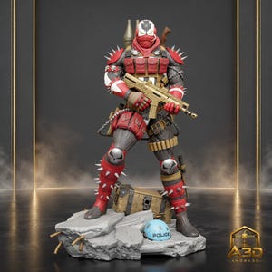 May include: A detailed action figure of a character wearing a red and black tactical suit with silver spikes on the shoulders and legs. The figure holds a tan rifle, features skull motifs on the knees and mask, and stands on a rocky base with a blue helmet.