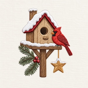 May include: An embroidery design featuring a wooden birdhouse with a red roof covered in white snow. A bright red cardinal sits on the perch. A green pine branch with red berries and a gold star ornament hang from the base of the birdhouse.