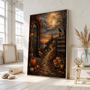 May include: A vertical wall art print depicting a twilight autumn scene with a stone path leading to a wooden door, surrounded by pumpkins, fall foliage, and a signpost with text pointing to Pumpkin Patch, Witches Way, Haunted Forest, and Old Graveyard.