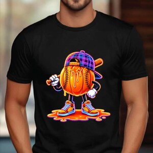 May include: A black t-shirt featuring a graphic of a cartoon baseball with a melting orange surface, wearing a purple plaid baseball cap and high-top sneakers. The character holds a wooden baseball bat and stands in a puddle of orange liquid.
