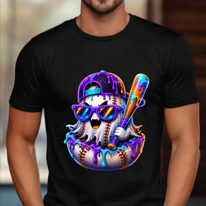 May include: A black short-sleeved t-shirt featuring a graphic of a white baseball ghost wearing a purple and blue backwards baseball cap and sunglasses. The ghost holds a wooden baseball bat, with vibrant purple and blue paint dripping.