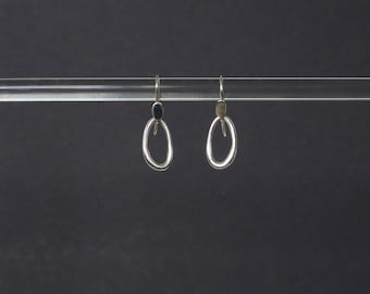 Silver dangling hoop earring