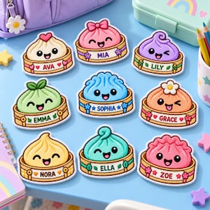 May include: A collection of nine embroidered patches shaped like cute, smiling dumplings in bamboo steamers. Each patch features a unique pastel color and a personalized name: Ava, Mia, Lily, Emma, Sophia, Grace, Nora, Ella, and Zoe, with decorative accents.