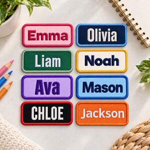 May include: Eight rectangular embroidered name patches with rounded corners. The patches feature the names Emma, Olivia, Liam, Noah, Ava, Mason, Chloe, and Jackson in various thread colors against contrasting fabric backgrounds with stitched borders.