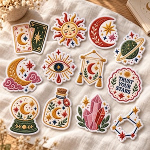 May include: A collection of twelve embroidered patches featuring celestial and mystical motifs including a sun, moon, planet, crystal ball, potion bottle, crystals, and a circular patch with the text Trust Your Stars in red, blue, and green.