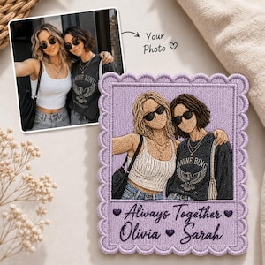 May include: A rectangular embroidered patch with a scalloped edge featuring a stitched recreation of a photograph showing two people wearing sunglasses. The patch includes the text Always Together Olivia Sarah with small purple heart icons.