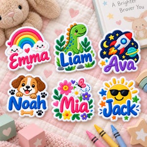 May include: Six embroidered patches featuring colorful designs and names. The patches display a rainbow with 'Emma', a green dinosaur with 'Liam', a space rocket with 'Ava', a puppy with 'Noah', flowers with 'Mia', and a sun with 'Jack'.