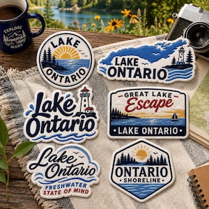 May include: Six embroidered patches featuring Lake Ontario themes. Designs include a circular sunrise, a lighthouse silhouette, a Great Lake Escape rectangular badge, and an Ontario Shoreline hexagon, all showcasing blue, white, and yellow colors.