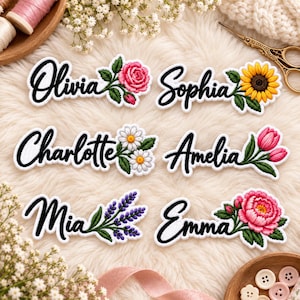 May include: Six embroidered name patches featuring black cursive lettering on a white background. Each patch includes a unique floral design: a pink rose for Olivia, a sunflower for Sophia, daisies for Charlotte, pink tulips for Amelia, purple lavender for Mia, and a pink peony for Emma.