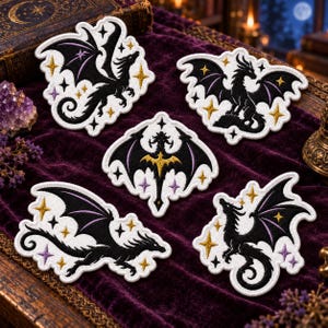 May include: Five embroidered patches featuring black dragons with purple wing accents, surrounded by gold and purple four-pointed stars on a white background. The designs include various dragon poses, including flying, perched, and standing, all with intricate black thread detailing.