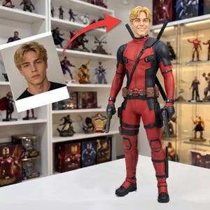 May include: A collectible action figure of a character wearing a red and black tactical suit with a utility belt, two holstered pistols, and two swords on the back. The figure features a head sculpt with blonde hair and a smiling facial expression.