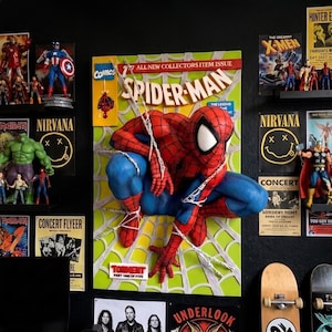 May include: A three-dimensional wall art piece featuring a sculpted Spider-Man figure in a crouching pose against a comic book cover background. The artwork displays the text Spider-Man, All New Collectors Item Issue, and Torment Part One of Five.