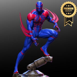 May include: A blue and red superhero figurine in a dynamic crouching pose, featuring a textured suit with a spider emblem on the chest and sharp red blades extending from the back. A gold circular badge with the text PREMIUM QUALITY is visible.