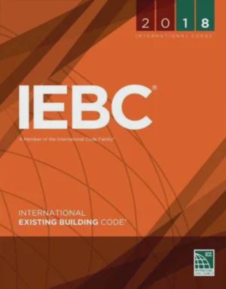 May include: The 2018 International Existing Building Code book cover features a bold orange background with dark brown diagonal lines and a globe graphic. The text IEBC is printed in large white letters, with International Existing Building Code below.