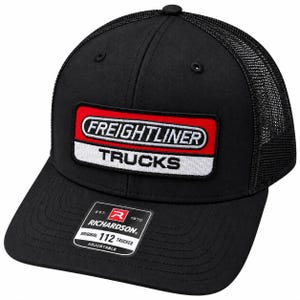 May include: A black trucker hat with a mesh back and a solid front panel. A rectangular patch features the text FREIGHTLINER TRUCKS in white and black on a red and white background. A black sticker on the brim reads RICHARDSON 112 TRUCKER.