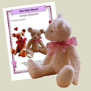 May include: A sewing pattern document titled Big Ben Bear featuring images of two teddy bears, one brown and one cream, alongside a physical cream-coloured plush teddy bear with a pink patterned ribbon tied around its neck in a bow.