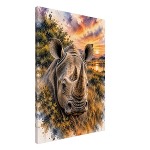 May include: A rectangular canvas print featuring a watercolour-style illustration of a rhinoceros head in the foreground. The background depicts a savanna landscape at sunset with orange, yellow, and purple hues, surrounded by dark green foliage.