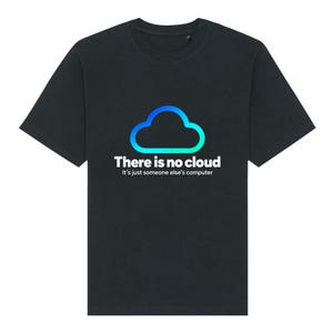 May include: A black short-sleeved t-shirt featuring a blue and green gradient cloud icon centred on the chest. Below the icon, the white text reads: There is no cloud, It's just someone else's computer. The shirt has a crew neckline.