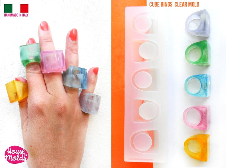 May include: Clear silicone mold for making cube-shaped rings. The mold has six cavities and is shown with finished rings in various colors, including green, blue, pink, and yellow.