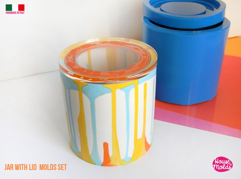 May include: A set of two silicone moulds for making a jar with a lid. The moulds are blue and the jar is shown in a colourful drip pattern with orange, yellow, and blue paint.