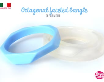 May include: A clear silicone mold for making octagonal faceted bangles. The mold is shown with a light blue bangle made with the mold. The text "Octagonal faceted bangle CLEAR MOLD" is visible in the image.