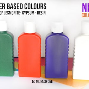 May include: Four bottles of water-based paint in green, red, purple, and white. Each bottle is 50 ml and labeled "NEW COLORS!" The bottles are ideal for use with Jesmonite, gypsum, and resin.