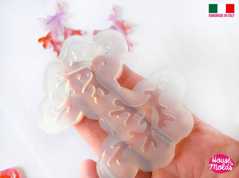 May include: Clear silicone mold for resin casting, featuring a delicate branch design. The mold is flexible and easy to use, perfect for creating unique jewelry or home decor.