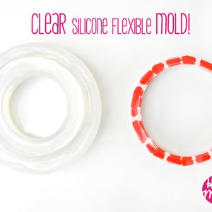 May include: Two silicone moulds for crafting. One is clear and the other is red with white accents. The text "CLEAR silicone FLEXIBLE MOLD!" is above the moulds. The text "House of Molds" is in the bottom right corner of the image.