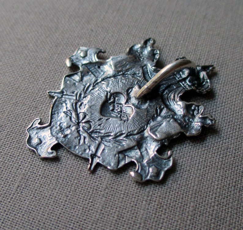 silver plated shield charm or pendant medal with crown sacred heart and swords jewelry finding