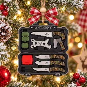 May include: A black plastic carrying case ornament featuring the name ANTHONY, containing miniature tools including a saw, hatchet, three knives with camouflage handles, two green storage boxes, a red box, and a multi-tool with a deer graphic.