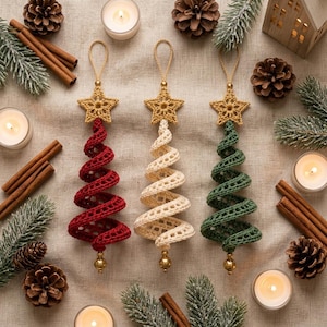 May include: Three spiral-shaped Christmas tree ornaments made of crocheted yarn in red, cream, and green. Each ornament features a gold-colored crocheted star at the top and a small gold bead at the bottom, suspended by a matching gold loop.