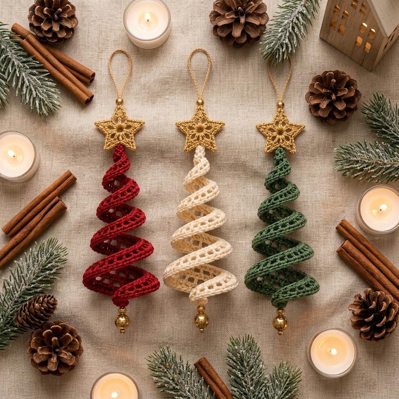 May include: Three spiral-shaped Christmas tree ornaments made of crocheted yarn in red, cream, and green. Each ornament features a gold-colored crocheted star at the top and a small gold bead at the bottom, suspended by a matching gold loop.