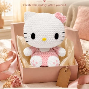 May include: A white and pink crocheted kitten plush toy with black oval eyes and a yellow nose, wearing a pink outfit with a bow. The text reads: Make a Gift Filled with Love, Create this cuddly kitten yourself, DIGITAL CROCHET PATTERN • NO PHYSICAL ITEM.